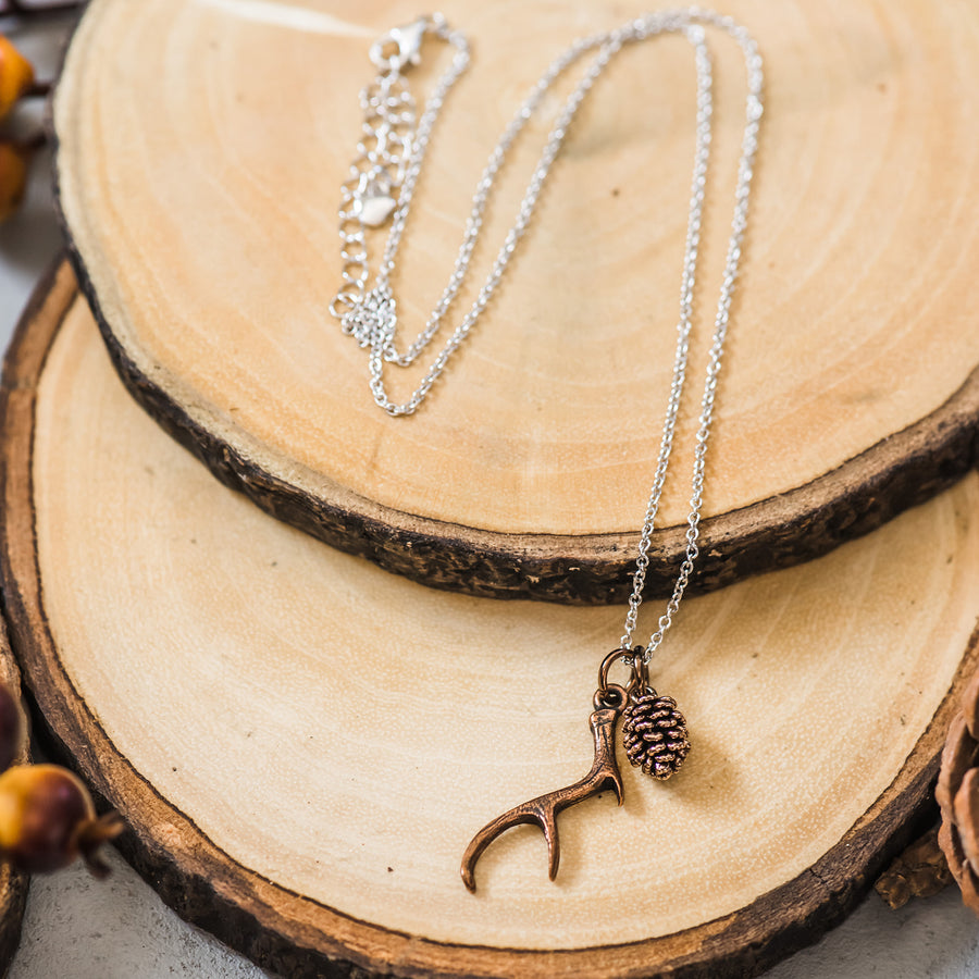 antler & pinecone necklace